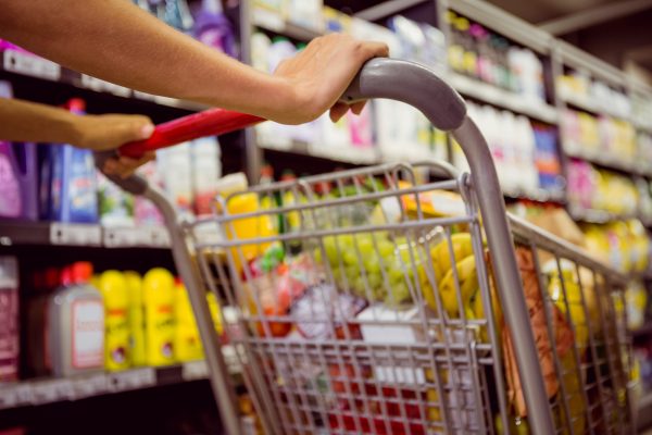 woman buys products with her cart at supermarket